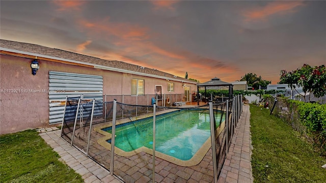 view of pool with a gazebo, a fenced backyard, a fenced in pool, and a patio area