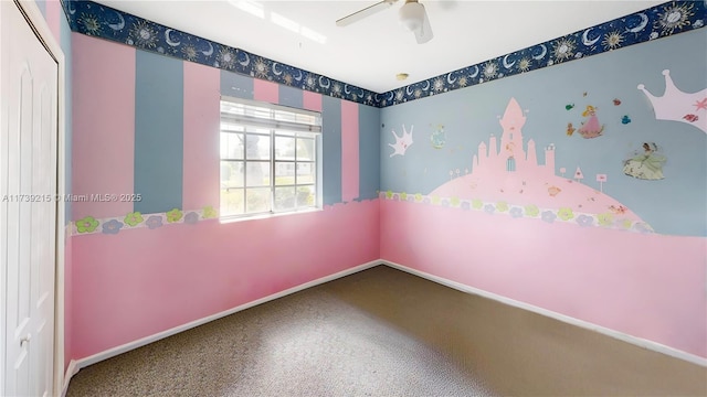empty room featuring carpet flooring, ceiling fan, and baseboards