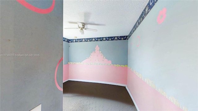 carpeted empty room with a textured ceiling and ceiling fan