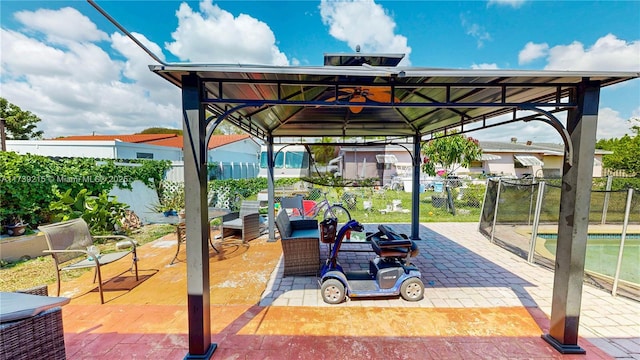 exterior space featuring fence and a gazebo