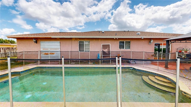 view of pool featuring a gazebo, a fenced backyard, and a fenced in pool