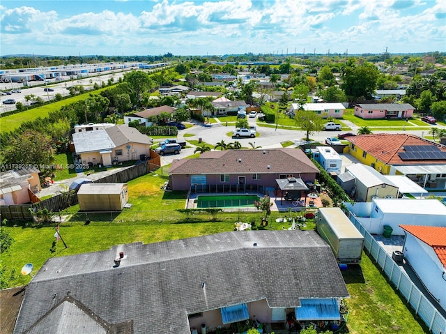 birds eye view of property with a residential view