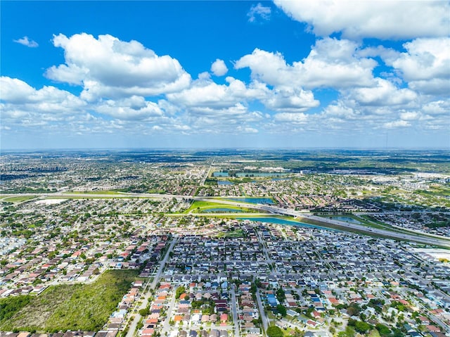 bird's eye view featuring a residential view and a water view