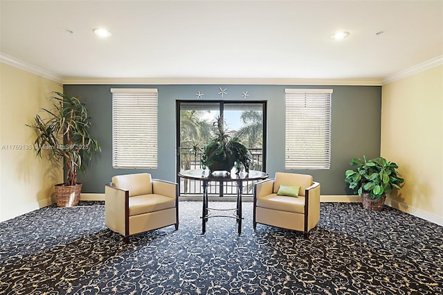 sitting room with ornamental molding, carpet floors, and baseboards