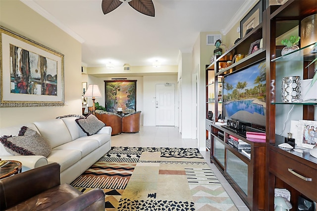 living room featuring ceiling fan, ornamental molding, and light tile patterned floors