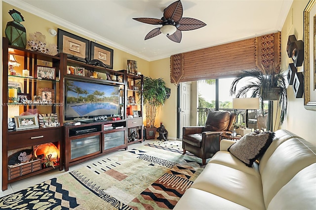 tiled living area with ornamental molding and ceiling fan