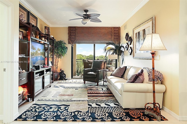 living room with crown molding, ceiling fan, and baseboards