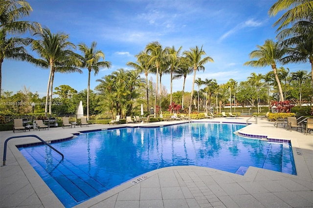 community pool with a patio