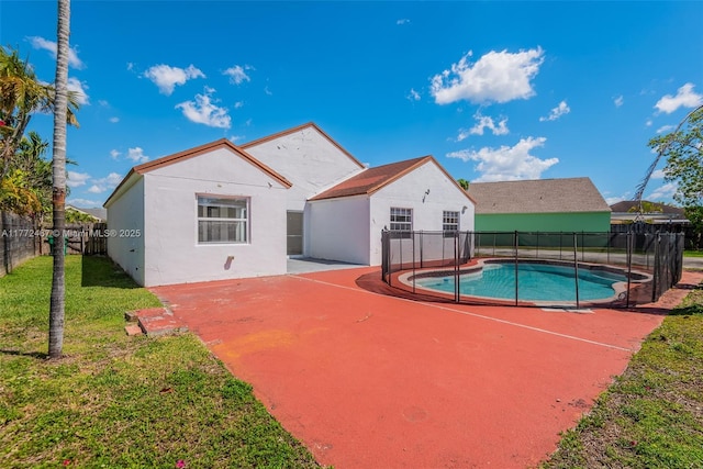 view of swimming pool with a fenced backyard, a lawn, a patio, and a fenced in pool