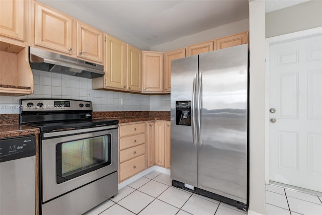 kitchen featuring light tile patterned floors, under cabinet range hood, stainless steel appliances, and light brown cabinetry