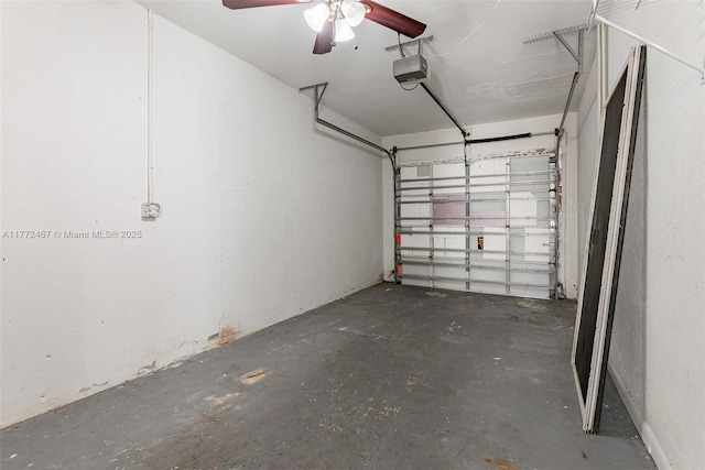 garage featuring a garage door opener and ceiling fan
