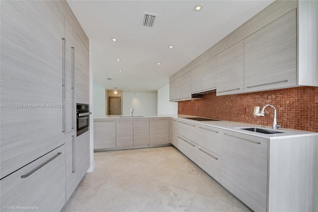 2645 S Bayshore Dr Unit 902, Miami, FL 33133 - kitchen featuring modern cabinets and a sink