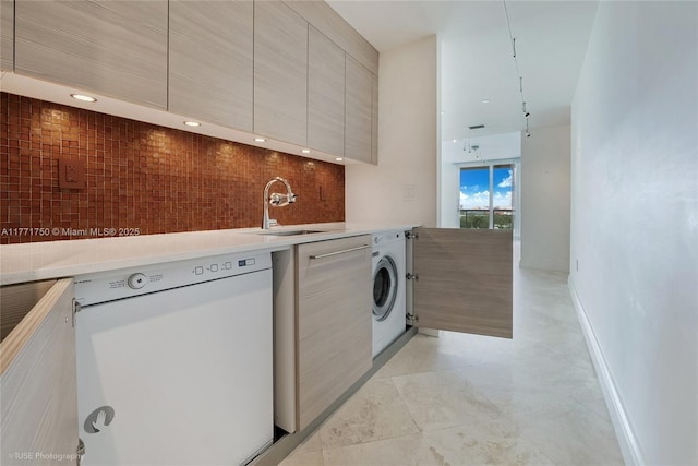 2645 S Bayshore Dr Unit 902, Miami, FL 33133 - kitchen featuring dishwasher, modern cabinets, washer / dryer, light countertops, and backsplash