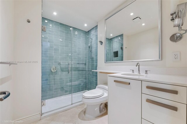 2645 S Bayshore Dr Unit 902, Miami, FL 33133 - bathroom featuring a stall shower, vanity, recessed lighting, and tile patterned flooring