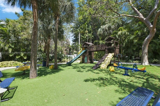 2645 S Bayshore Dr Unit 902, Miami, FL 33133 - view of playground with a yard and view of scattered trees