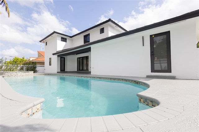 pool featuring a patio area