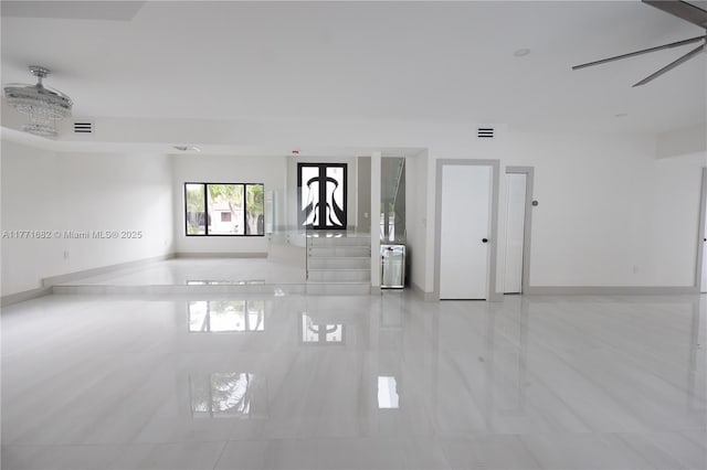 spare room featuring baseboards and visible vents