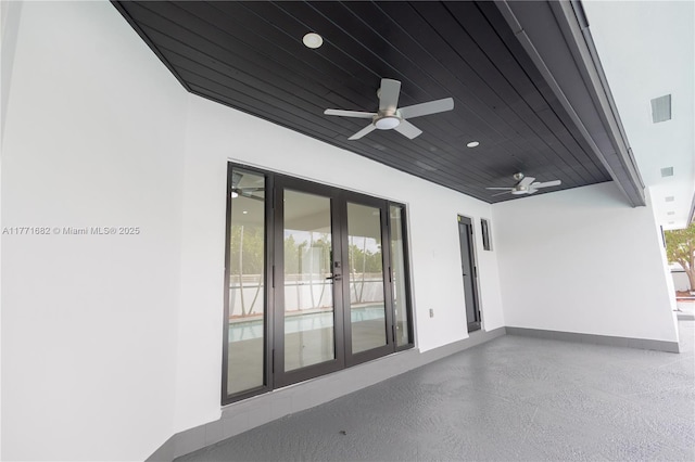 view of patio / terrace featuring ceiling fan and french doors