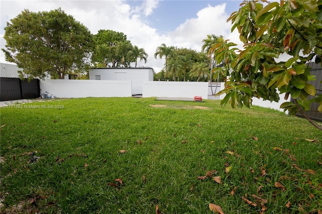 view of yard with a fenced backyard