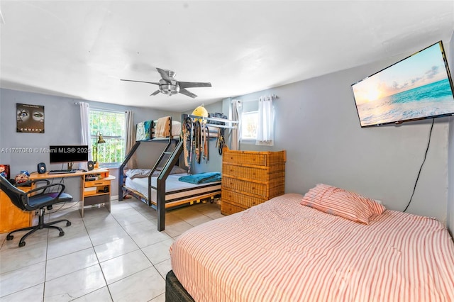 bedroom with ceiling fan and light tile patterned floors