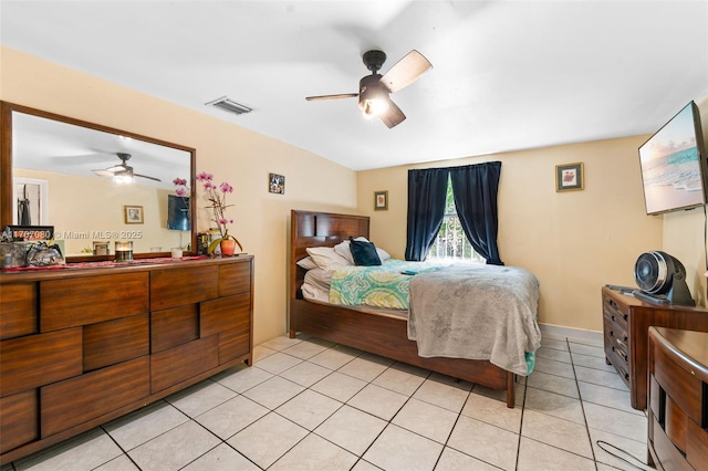 bedroom with a ceiling fan, visible vents, and light tile patterned floors