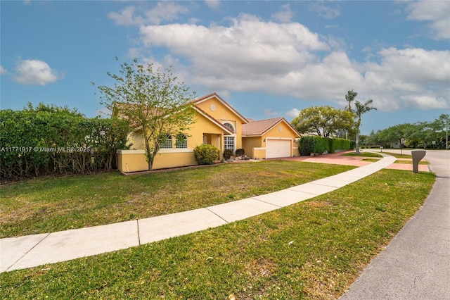 1400 SW 54th Ave, Plantation, FL 33317 - view of front facade featuring an attached garage, a front lawn, driveway, and stucco siding