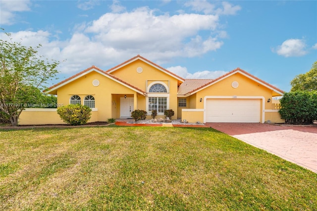 1400 SW 54th Ave, Plantation, FL 33317 - view of front of home with an attached garage, a tile roof, stucco siding, and driveway