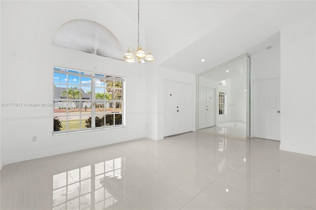1400 SW 54th Ave, Plantation, FL 33317 - unfurnished room featuring tile patterned flooring, baseboards, a chandelier, lofted ceiling, and recessed lighting
