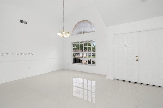1400 SW 54th Ave, Plantation, FL 33317 - entrance foyer with high vaulted ceiling, tile patterned flooring, and a chandelier