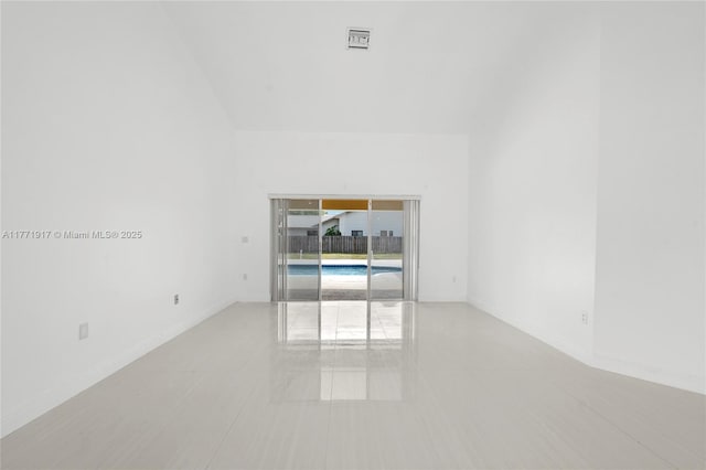 1400 SW 54th Ave, Plantation, FL 33317 - spare room with light tile patterned flooring, lofted ceiling, and baseboards