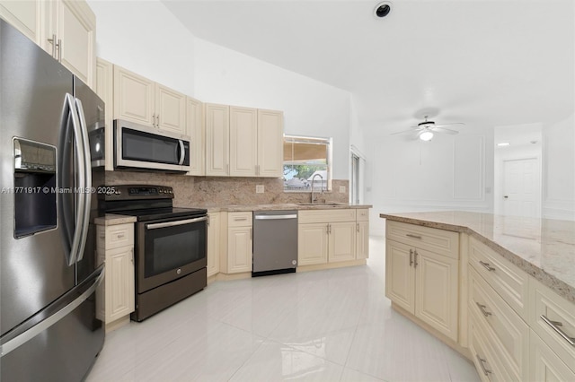 1400 SW 54th Ave, Plantation, FL 33317 - kitchen featuring appliances with stainless steel finishes, decorative backsplash, a sink, cream cabinets, and a ceiling fan