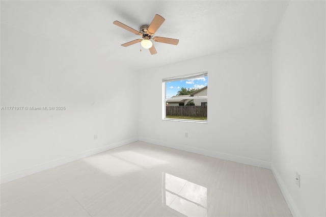 1400 SW 54th Ave, Plantation, FL 33317 - empty room with baseboards, ceiling fan, and tile patterned floors