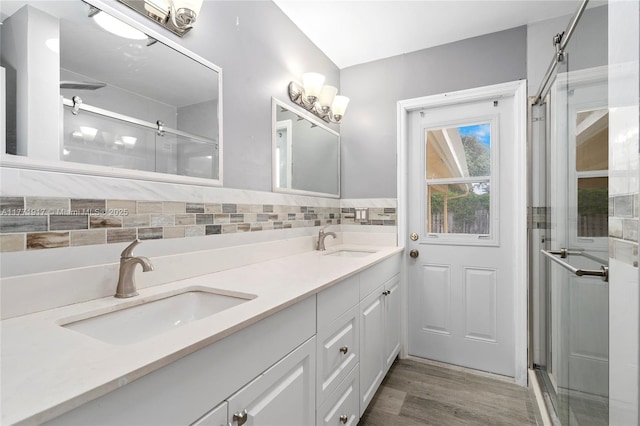 1400 SW 54th Ave, Plantation, FL 33317 - full bath with a stall shower, double vanity, tasteful backsplash, and wood finished floors
