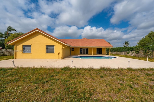 1400 SW 54th Ave, Plantation, FL 33317 - back of house featuring stucco siding, a tiled roof, and a patio