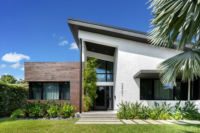 2421 NE 199th St, Miami, FL 33180 - property entrance featuring stucco siding