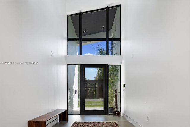 2421 NE 199th St, Miami, FL 33180 - interior space with a towering ceiling and concrete flooring