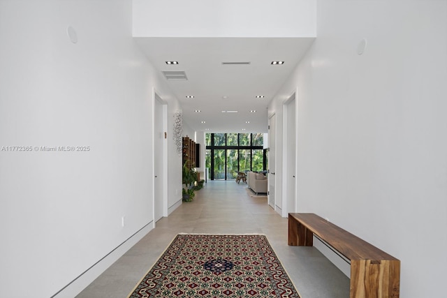 2421 NE 199th St, Miami, FL 33180 - hall featuring visible vents, recessed lighting, a wall of windows, and finished concrete floors