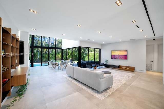 2421 NE 199th St, Miami, FL 33180 - living area with recessed lighting and a wall of windows