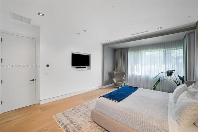 2421 NE 199th St, Miami, FL 33180 - bedroom with light wood-style flooring, recessed lighting, baseboards, and visible vents