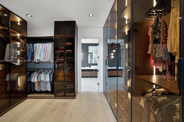 2421 NE 199th St, Miami, FL 33180 - walk in closet featuring wood finished floors