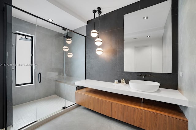 2421 NE 199th St, Miami, FL 33180 - bathroom with tile walls, decorative backsplash, vanity, and a shower stall