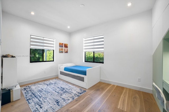 2421 NE 199th St, Miami, FL 33180 - bedroom with baseboards, recessed lighting, and light wood finished floors