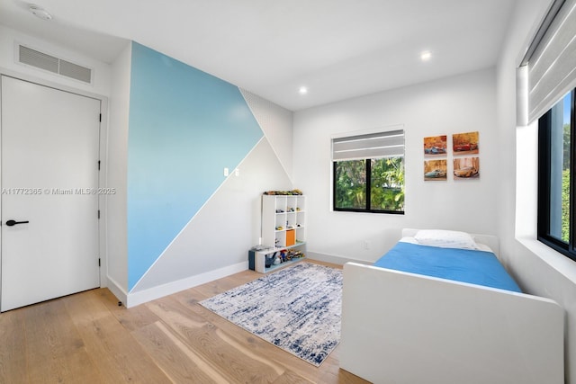 2421 NE 199th St, Miami, FL 33180 - bedroom featuring baseboards, visible vents, recessed lighting, and wood finished floors