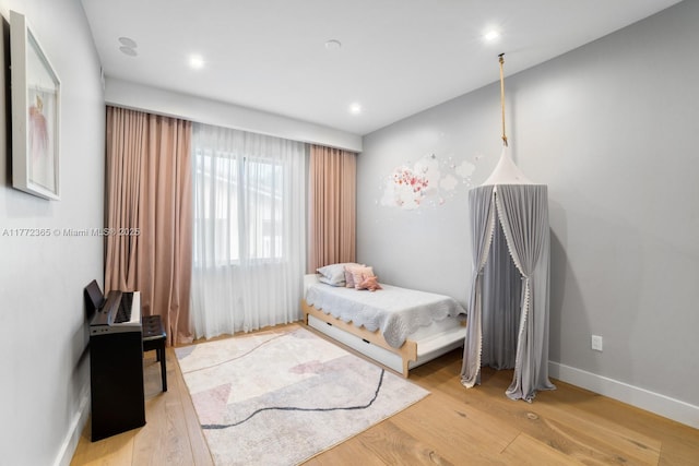 2421 NE 199th St, Miami, FL 33180 - bedroom with baseboards, wood finished floors, and recessed lighting