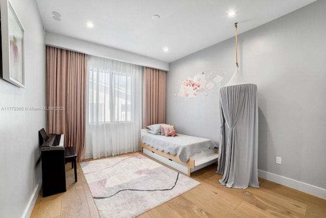 2421 NE 199th St, Miami, FL 33180 - bedroom featuring baseboards, light wood finished floors, and recessed lighting