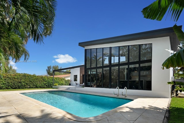 2421 NE 199th St, Miami, FL 33180 - view of swimming pool with a patio and a fenced in pool