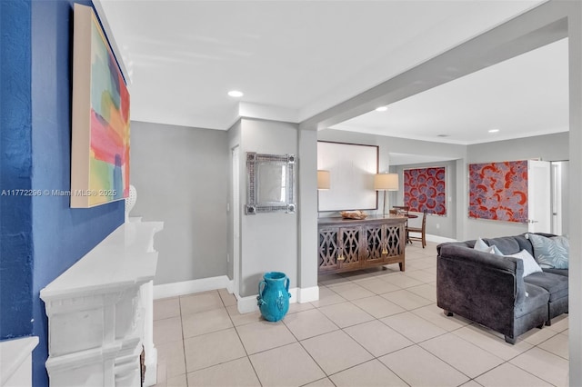 tiled living room with recessed lighting and baseboards