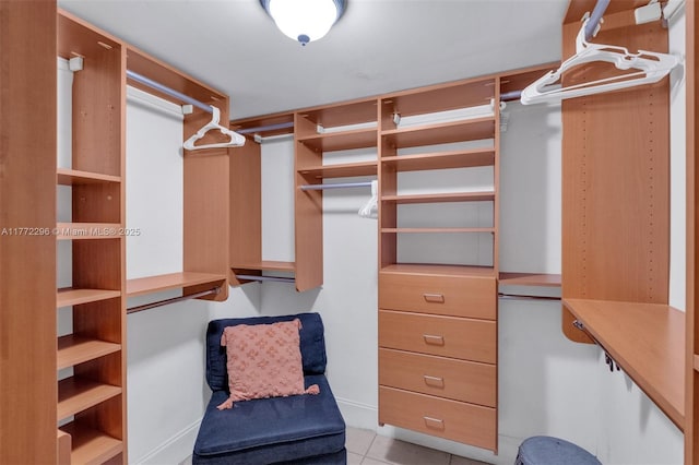 walk in closet featuring light tile patterned floors
