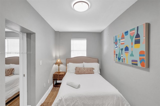 bedroom with carpet flooring and baseboards