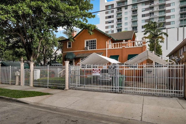 view of gate featuring a fenced front yard